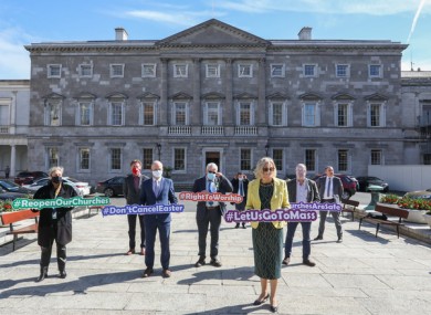 Oireachtas members gathered at Leinster House this morning calling for mass to be allowed to go ahead.
