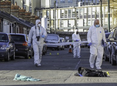 Garda technical bureau members at the scene of the shooting.