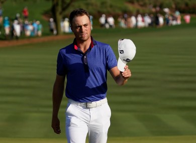Justin Thomas waves on the 18th green after the final round of The Players Championship.