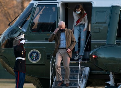 President Joe Biden, followed by his granddaughter Natalie Biden, disembarks Marine One on the South Lawn upon arrival at the White House