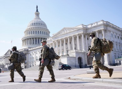 National Guard members walk near the Capitol
