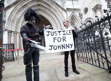 Supporters of Johnny Depp outside the Royal Courts of Justice in London today.