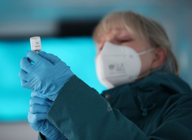 An NHS nurse prepares a dose of the Oxford-AstraZeneca Covid-19 vaccine