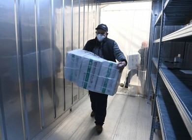 An employee unloads the newly arrived coronavirus vaccines in Budapest