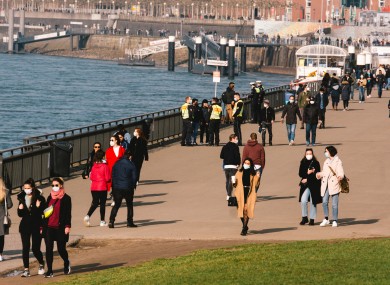 Policemen ask people to wear face masks and not to stay in public area near Rhine river in Dusseldorf, Germany