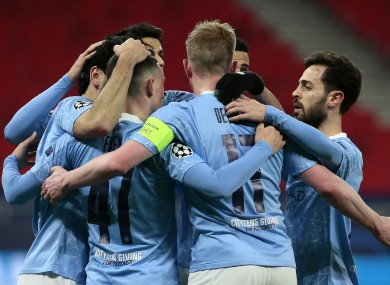 Manchester City's Ilkay Gundogan (left) celebrates scoring.
