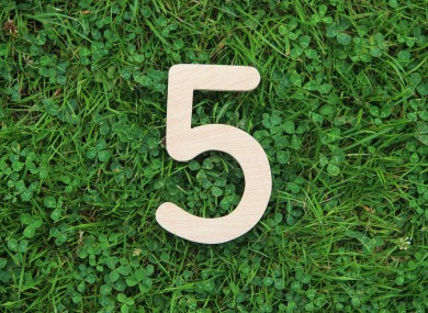 On closer inspection the background in this stock image appears to be clover rather than shamrock. Please forgive us.