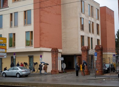 Journalists wait outside the clinic in Potsdam, Germany