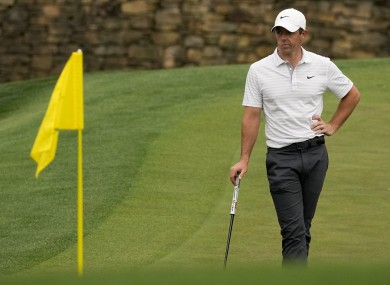Rory McIlroy waits to putt on the 11th green.