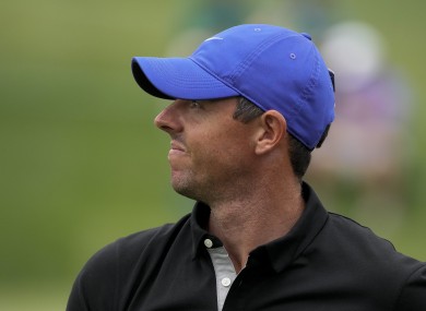 Rory McIlroy watches his tee shot.