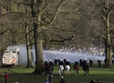 Police using a water cannon against crowds at a park in Brussels today.