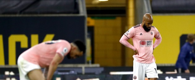 David McGoldrick is dejected as Sheffield United's return to the Championship is confirmed.