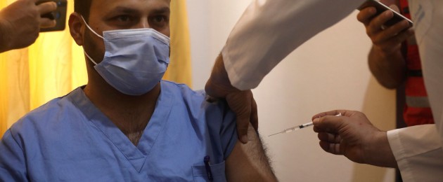 A Syrian nurse receives AstraZeneca Covid-19 vaccine in Idlib, Syria.