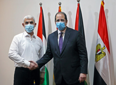 Yehiyeh Sinwar (left), the top Hamas leader in Gaza with the head of the Egyptian General Intelligence Abbas Kamel (right).
