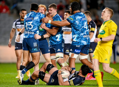 Blues' Finlay Christie celebrates after scoring a try.