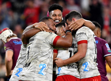 The Crusaders celebrate a try against the Reds.