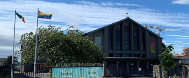 Irish and LGBT+ Pride flags outside the Ballyfermot Assumption Parish Church