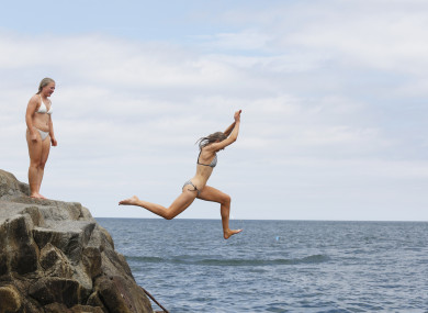Swimmers enjoying the good weather at the Forty foot in Dublin.