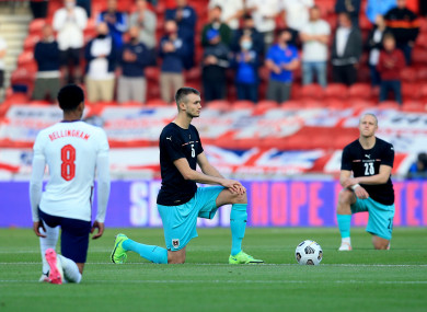 Austria's Sasa Kalajdzic takes the knee ahead of the International Friendly at The Riverside.