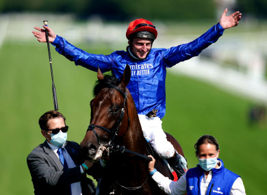 Adam Kirby celebrates after winning the Derby on Adayar.