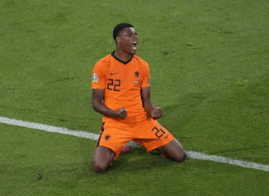 Netherlands player Denzel Dumfries celebrates.