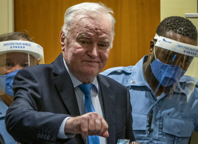 Former Bosnian Serb military chief Ratko Mladic enters the court room in The Hague, Netherlands