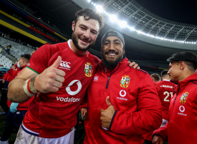 Robbie Henshaw and Bundee Aki celebrate the Lions' win.