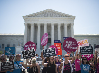 Pro-choice and pro-life demonstrators rally outside of the US Supreme Court. 2016.