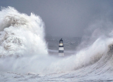 Huge waves crash against the lighthouse in Seaham Harbour, County Durham, in the tail end of Storm Arwen