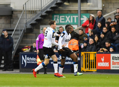 Festy Ebosele is congratulated by Derby County team-mate Max Bird after scoring against Millwall.