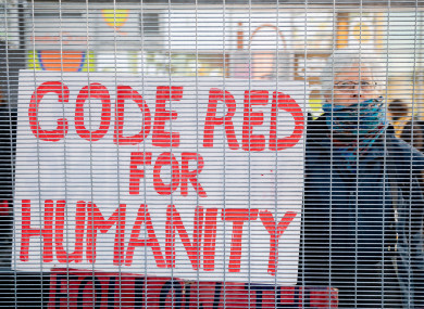 A woman holding a sign near the SEC conference centre in Glasgow last week.