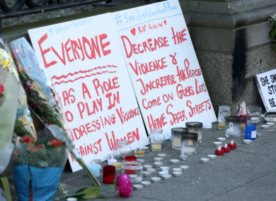 Placards, candles and flowers outside the Dáil this morning.