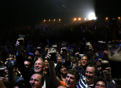A crowd share a toast at the Guinness Storehouse.