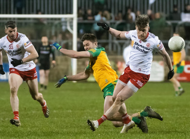 Donegal's Conor O'Donnell and Tyrone's Johnny Monroe.