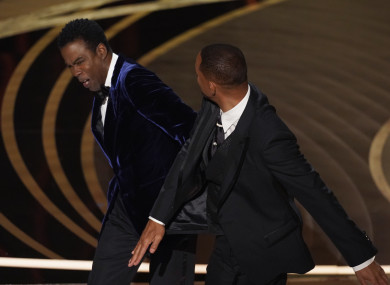 Will Smith slapping Chris Rock on stage at the Oscars on Sunday.
