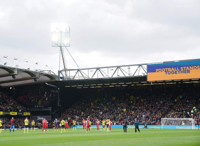 'Football Stands Together' is displayed on the big screen at Vicarage Road.
