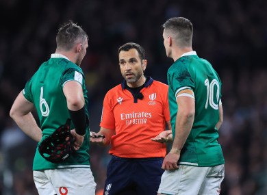 Referee Mathieu Raynal with Peter O'Mahony and Johnny Sexton.