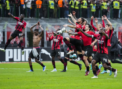 Milan players celebrate at the end.