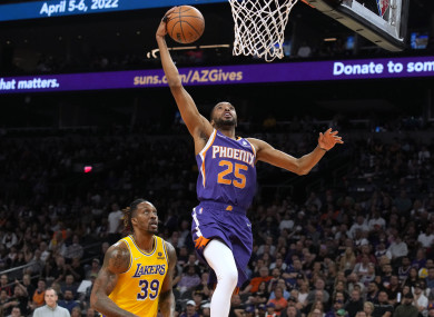 Phoenix Suns forward Mikal Bridges drives past Los Angeles Lakers center Dwight Howard.