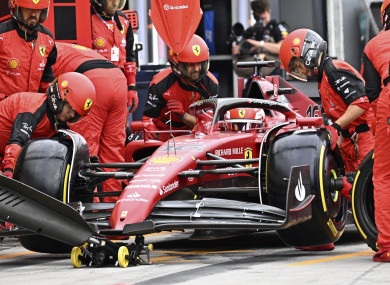 Mechanics of Ferrari driver Charles Leclerc of Monaco change his tires.