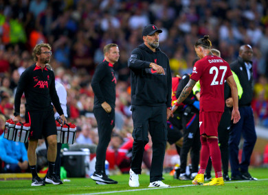 Liverpool's Darwin Nunez walks past manager Jurgen Klopp as he leaves the pitch.