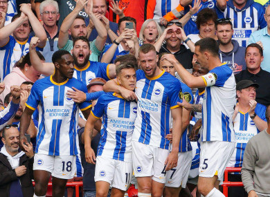 Leandro Trossard celebrates scoring with Brighton teammates.