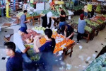 CCTV footage screenshot shows the moment of the explosion of the pager of someone in a vegetables shop