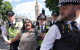 Police begin making arrests after banned Palestine Action group gathers in central London