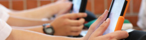 Money saved through free schoolbooks scheme is being swallowed up by school laptops, parents say