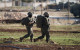 Israeli forces shoot dead two unarmed Palestinian men who had surrendered to them