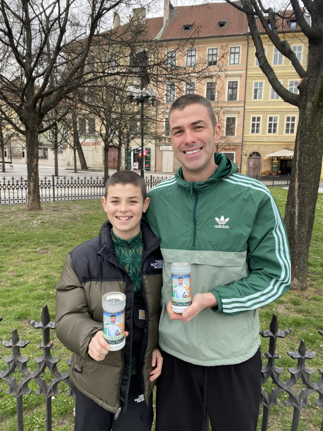 This father-son team has brought along homemade Saint Troy Parrott candles for a Prague miracle