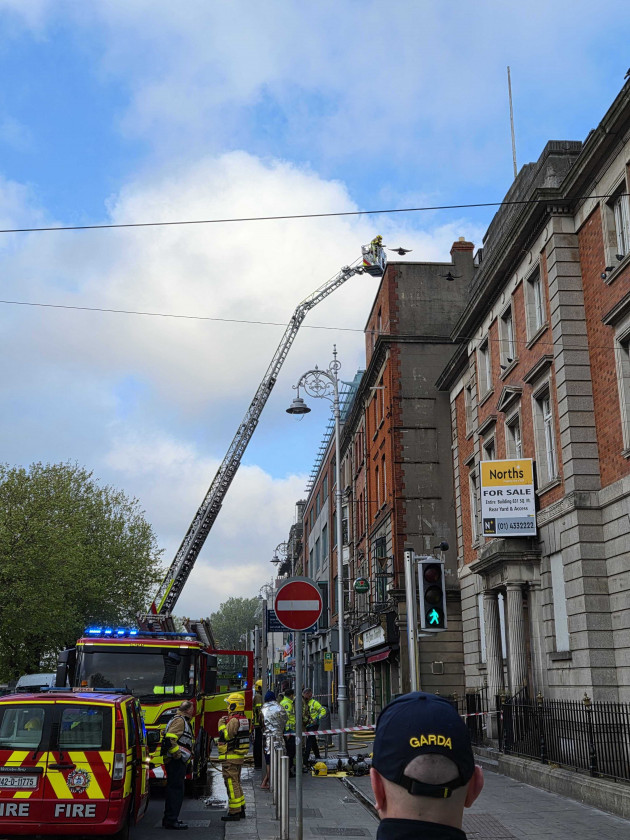 Two hospitalised and Luas services delayed after fire in Dublin city centre