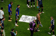 Argentina players celebrate with ‘Falklands are ours’ sign after putting England out of World Cup